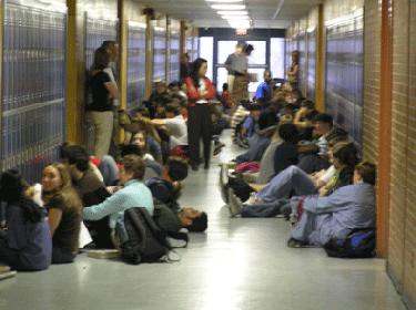 a group of people sitting on the floor