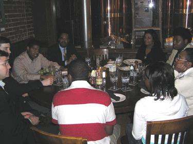 a group of people sitting around a table