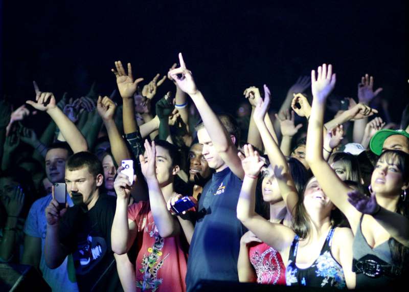 a group of people with their hands up