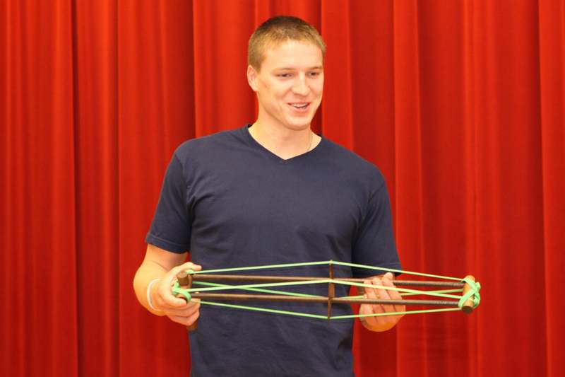 a man holding a slingshot