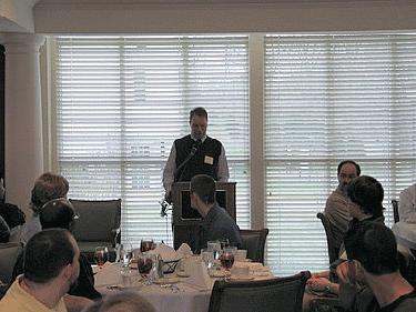 a man standing at a podium giving a speech