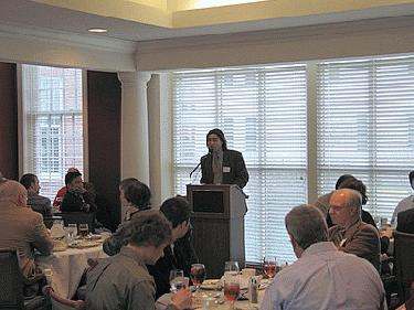 a woman standing at a podium