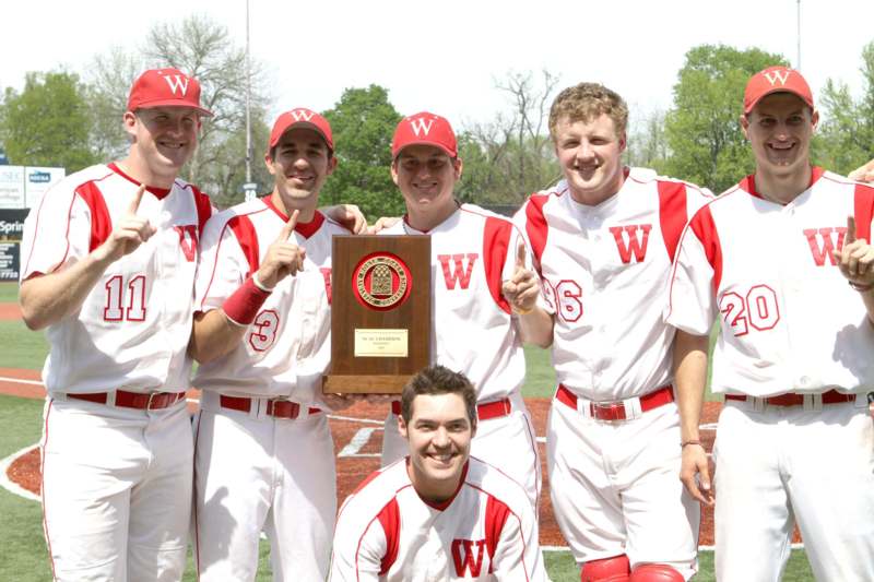 a group of men in baseball uniforms holding a plaque