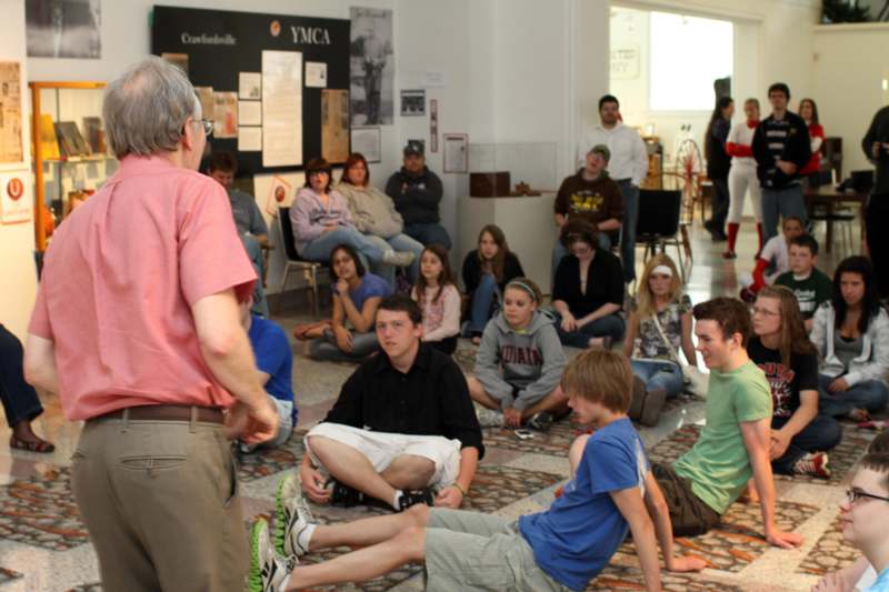 a group of people sitting on the floor