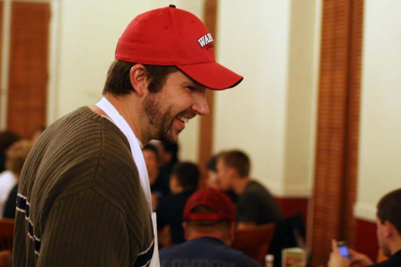 a man wearing a red hat