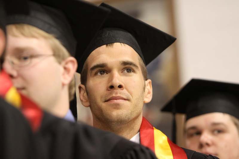 a man in graduation cap and gown