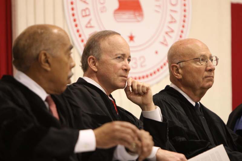 a group of men in black robes