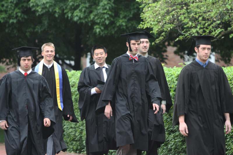 a group of people wearing graduation gowns