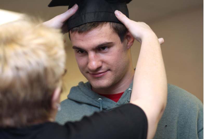 a man wearing a graduation cap
