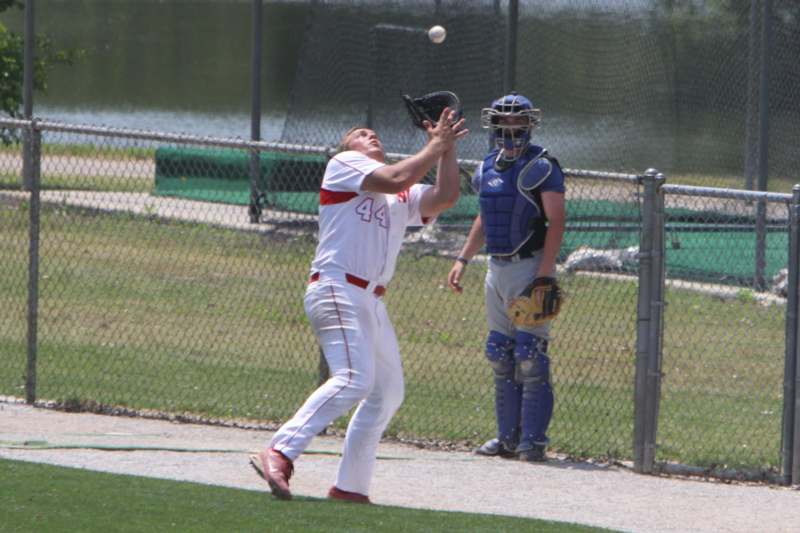 a baseball player catching a ball
