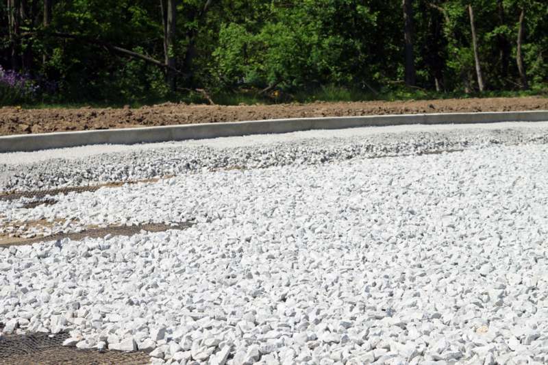 a road with white rocks