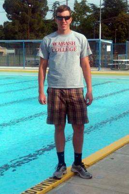 a man standing in a pool