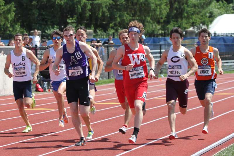 a group of people running on a track