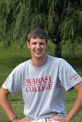 a man standing in a grassy area