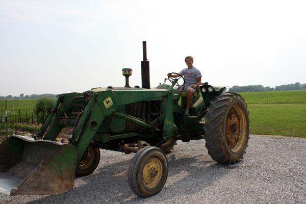 a man driving a tractor