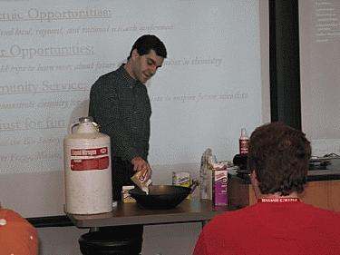a man pouring food into a bowl