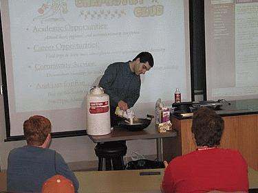 a man pouring food into a bowl