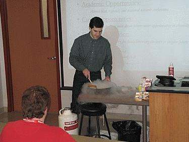 a man using a whiteboard to make a presentation