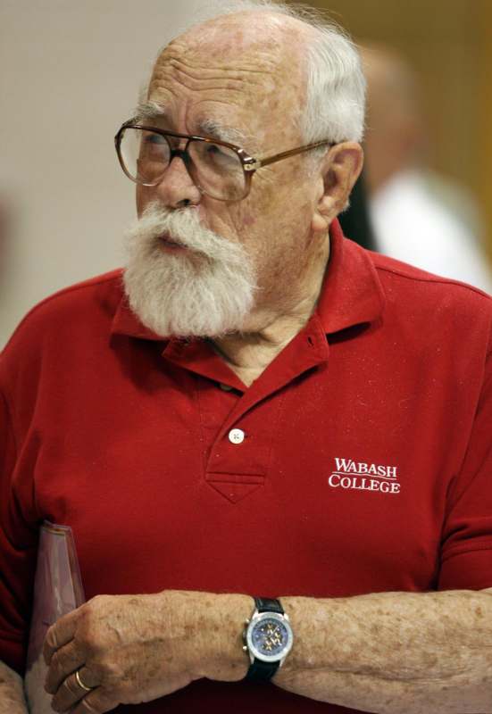 a man with a white beard and glasses