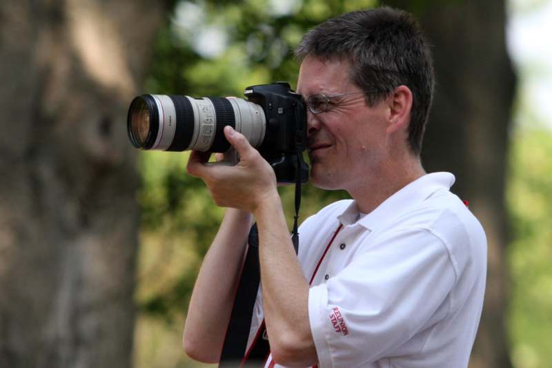a man holding a camera to his face