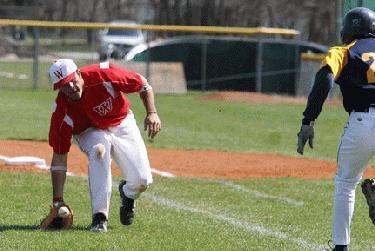 a baseball player chasing a ball