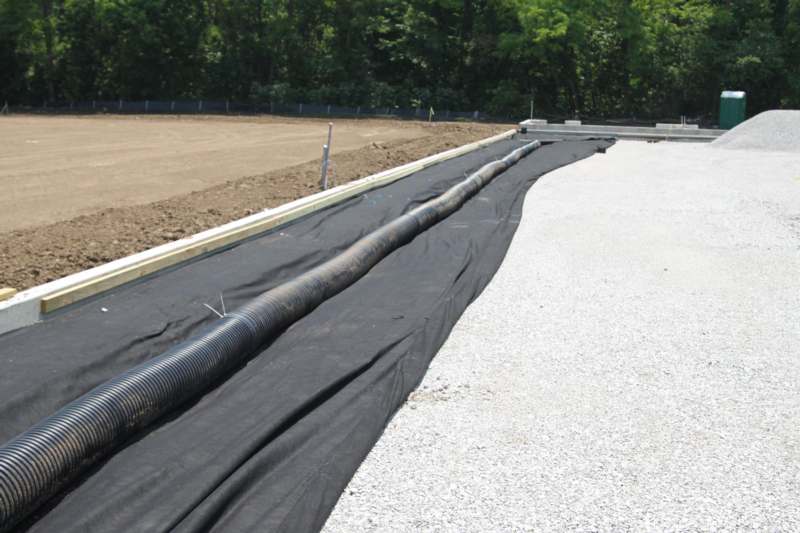 a black plastic pipe on a road