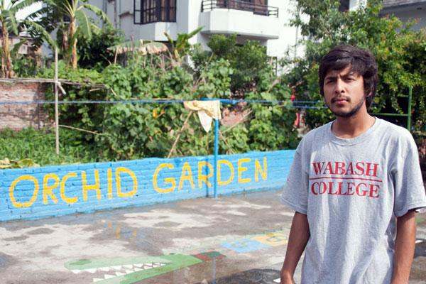 a man standing in front of a sign