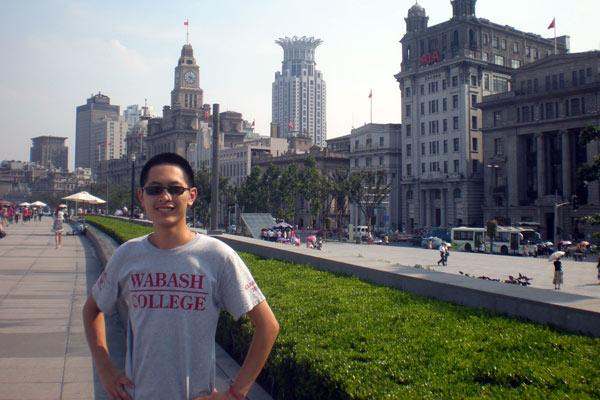 a man standing in front of a city