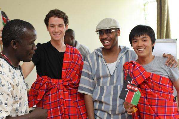 a group of men wearing red plaids