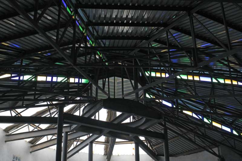 a metal roof with colorful glass panels