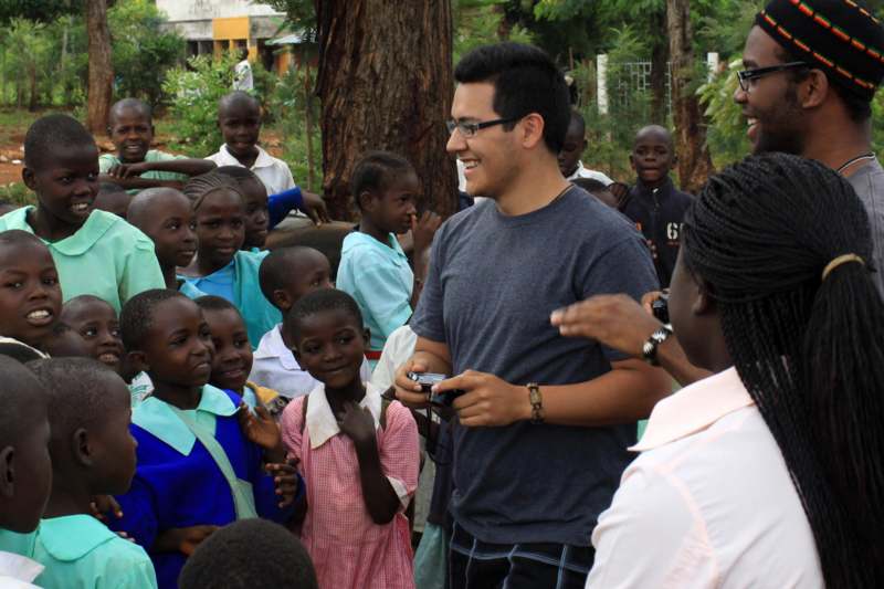 a man standing in front of a group of children