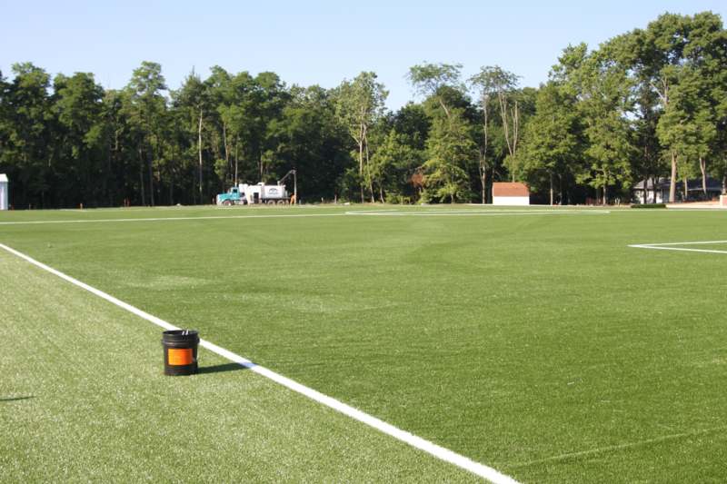 a field with a black container on the side