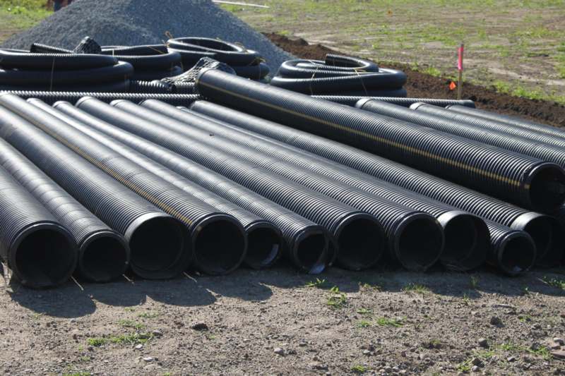 a pile of black pipes
