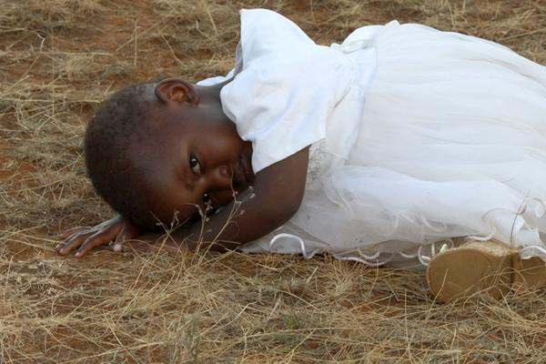 a child lying on the ground