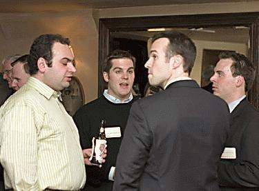 a group of men talking to each other