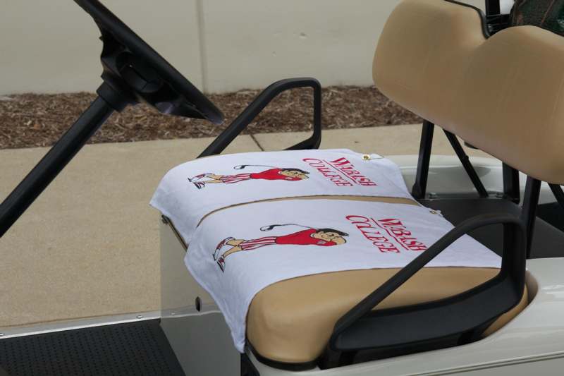 a pair of towels on a golf cart