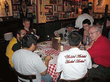 a group of people sitting around a table