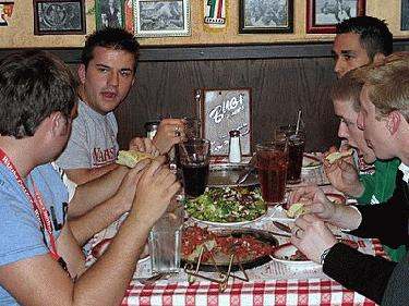 a group of people eating at a table