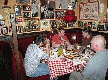 a group of people sitting at a table