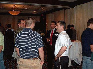 a group of men talking in a room
