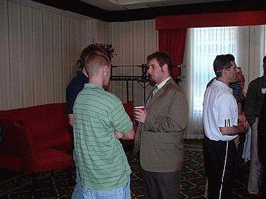 a group of men standing in a room