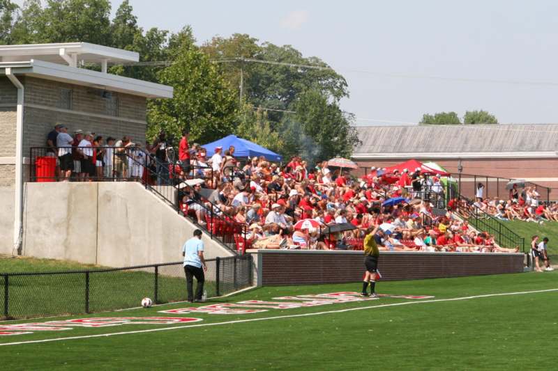 a crowd of people watching a game