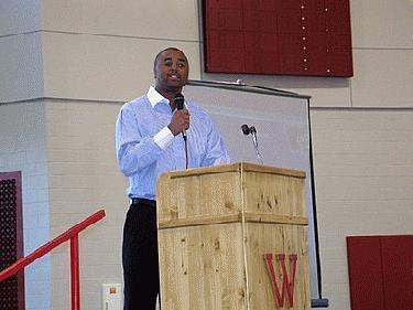 a man standing at a podium