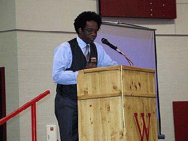 a man standing at a podium