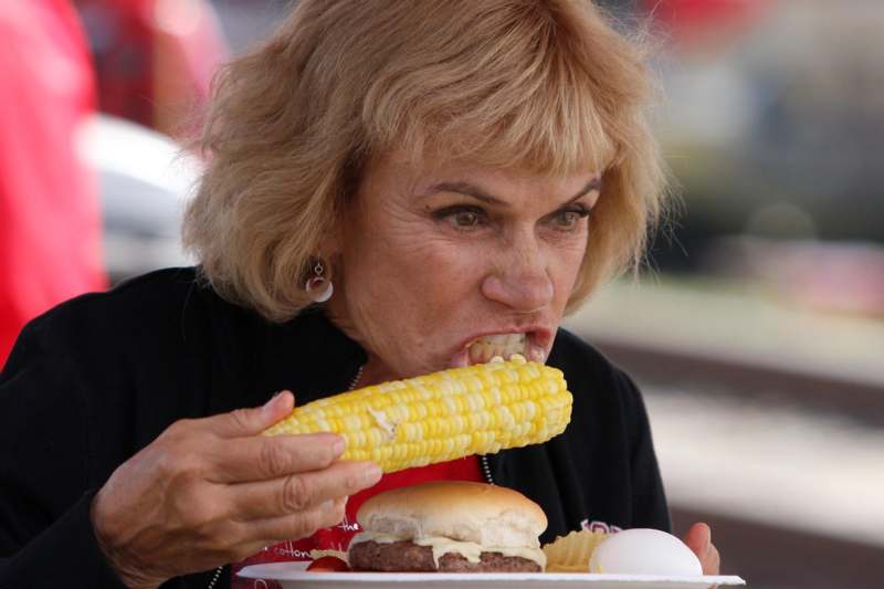 a woman eating corn on the cob