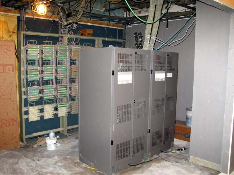 a room with a large cabinet and wires