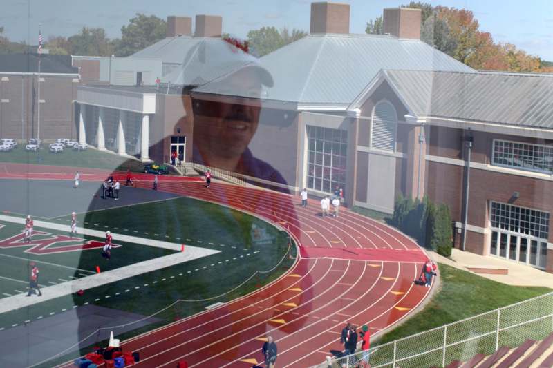 a reflection of a man on a track