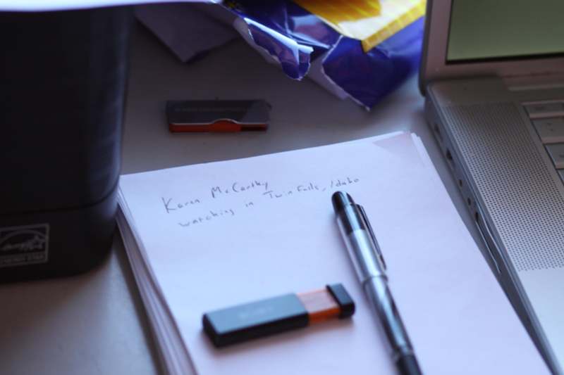 a pen and a piece of paper on a desk