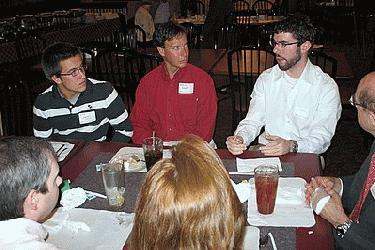 a group of people sitting at a table