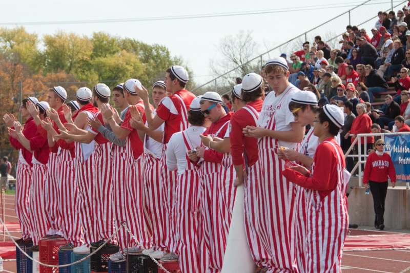a group of people in striped outfits